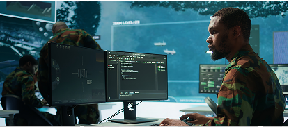 A soldier sitting at a desk working